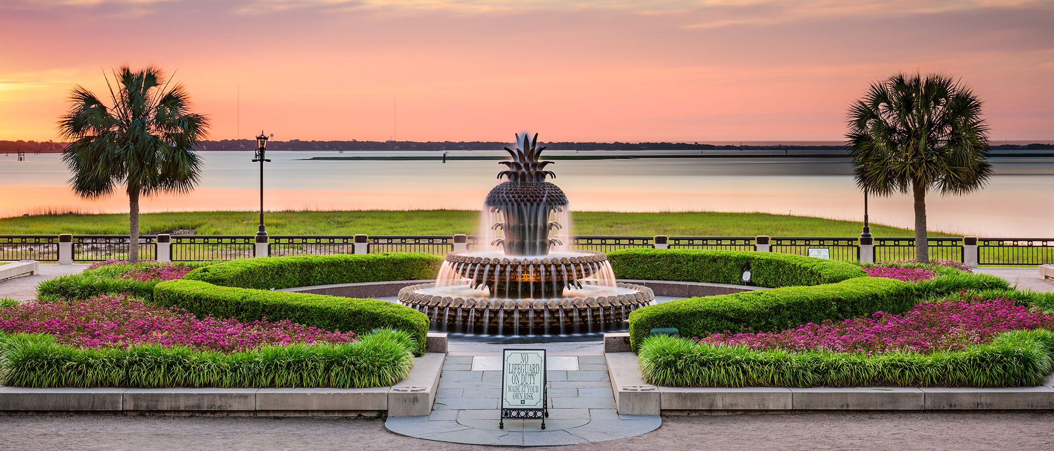 The Pineapple Fountain at Waterfront Park in Charleston, South Carolina at sunset